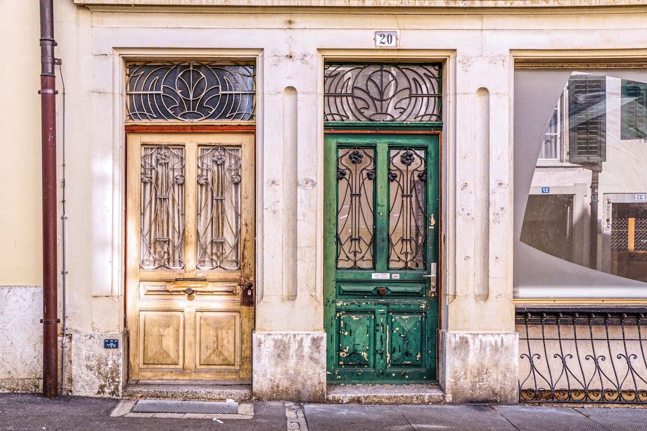 Replacing worn weather stripping and adjusting misaligned door frames in a historic 1920s home.